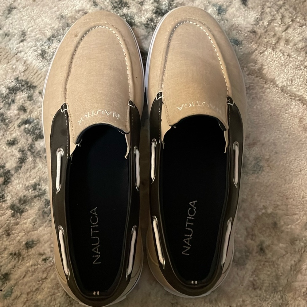 Nautical Men’s slip ons - slight spot on left shoe shown in picture. Like new